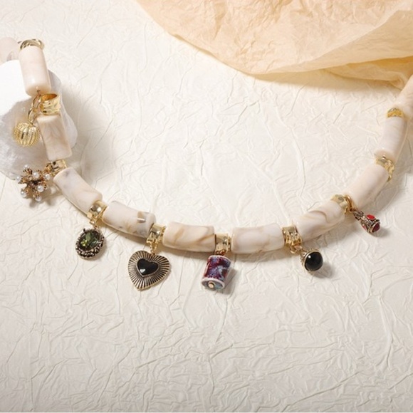Elegant Cream and Gold Charm Necklace - Picture 4 of 4